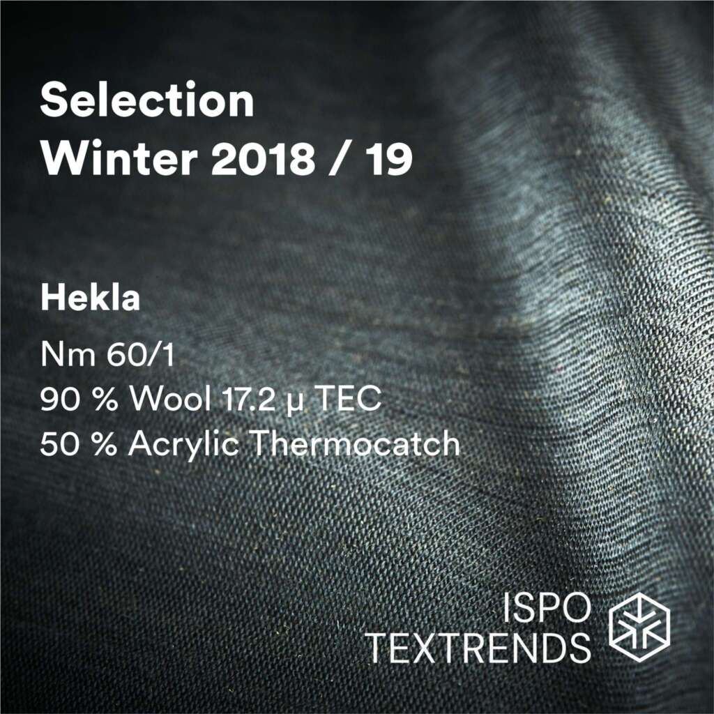 Close-up of a textured fabric with text detailing wool-acrylic blend yarn specifications, labeled Selection Winter 2018/19, Hekla, and ISPO Textrends..