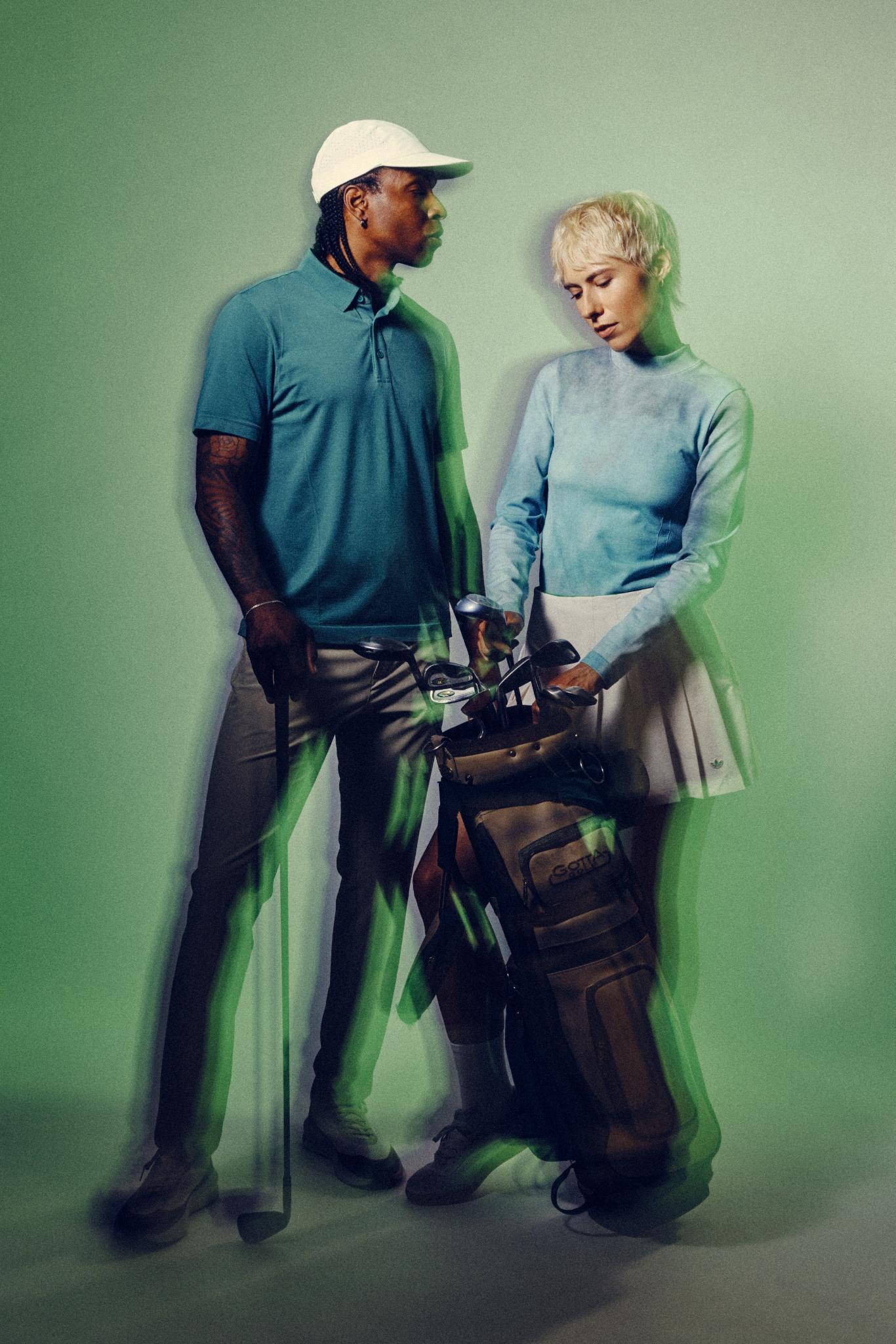 Two people in golf attire stand with a golf bag and clubs against a green background. The image has a double exposure effect, giving a sense of motion or blur.