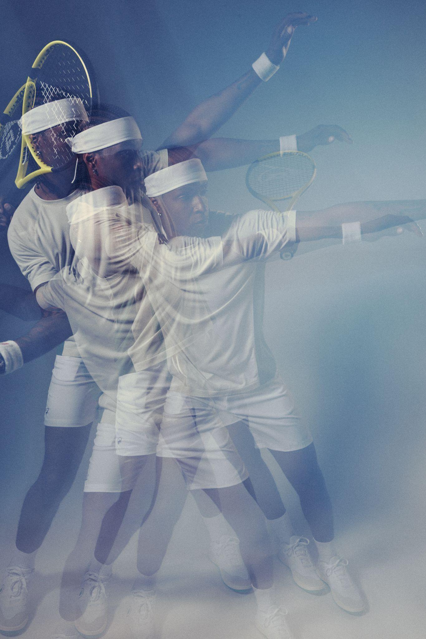 A tennis player in white sportswear and headband is captured in multiple exposure as they swing a racket, creating a dynamic motion effect against a blue-toned background.